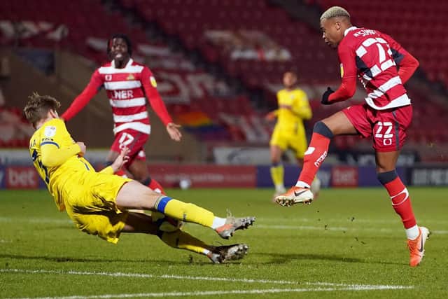 Doncaster Rovers' Elliot Simoes fires in a shot. (PA)