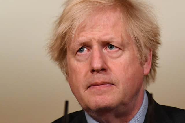 Boris Johnson is coming under pressure over his handling of Covid as the UK death toll surpasses 100,000 people.
