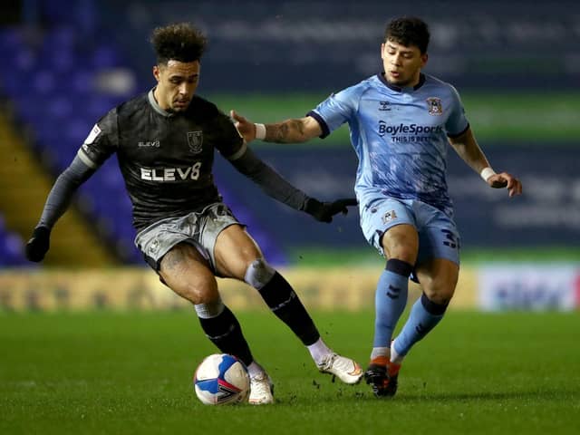 Coventry City's Gustavo Hamer (right) and Sheffield Wednesday's Andre Green battle for the ball. Picture: PA.
