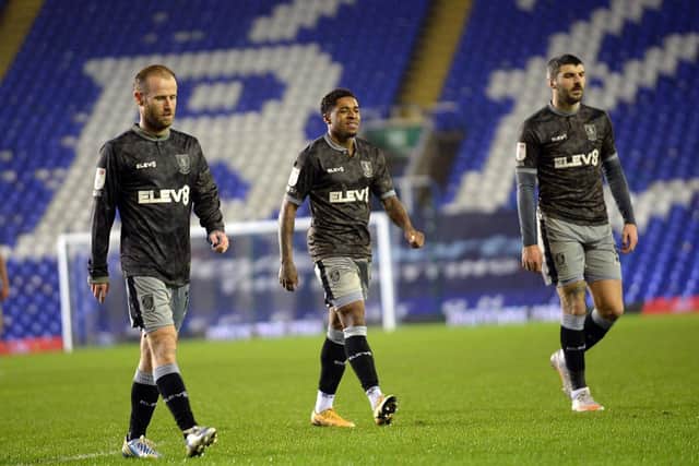 Despair at the final whistle for Owls trio of Barry Bannan, Kadeem Harris and Callum Paterson (Picture: Steve Ellis)