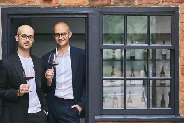 Daniel Curro (right) with his partner, Moreno Carbone outside The Vices Archive in York. Photo: Olivia Brabbs Photography
