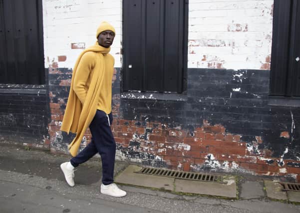 Shot on location in Holbeck, Leeds: 
Recycled cashmere beanie hat, £45, and scarf, £95, and ribbed crew sweater in amber, £165; organic cotton track pants, £70. All at cutandpin.com. SHOOT CREDITS: Tara Sagar Photography; Model – Obed Wilson @ Boss models; Location – Holbeck, Leeds; studio images – Box Photographic; Styling – Martin Parker.