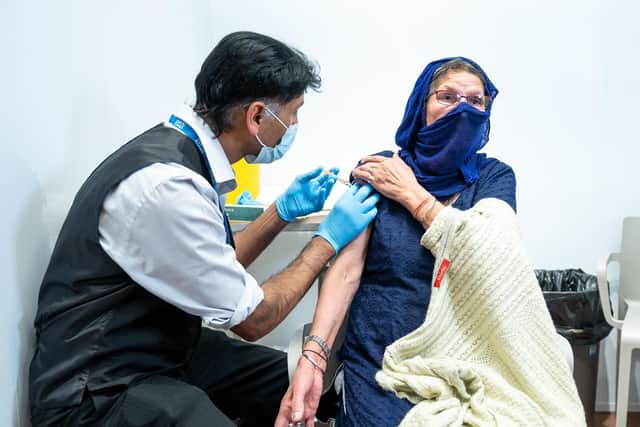 Harbans Kaur, aged 78, from Smethwick, receiving her jab.