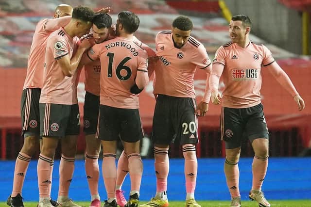 Sheffield United's Oliver Burke (fourth left) celebrates scoring their side's winner at Manchester United (Picture: PA)