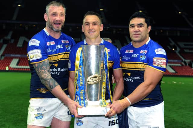 WINNERS: Jamie Peacock, Kevin Sinfield and Kylie Leuluai celebrate with the 2015 Super League Grand Final trophywith the trophy at Old Trafford. 
Picture : Jonathan Gawthorpe.