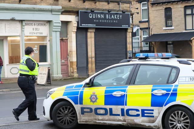 Police patrol the salon after the owner indicated she would reopen (Photo: Danny Lawson/PA Wire)