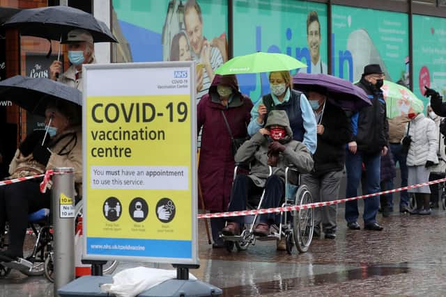 People braved inclement weather over the weekend to receive their Covid vaccines.