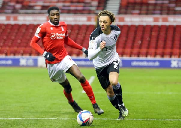 Barnsley's Jordan Williams gets away from Nottingham Forest's Sammy Ameobi (left) during the Sky Bet Championship match at the City Ground (Picture: Isaac Parkin/PA Wire)