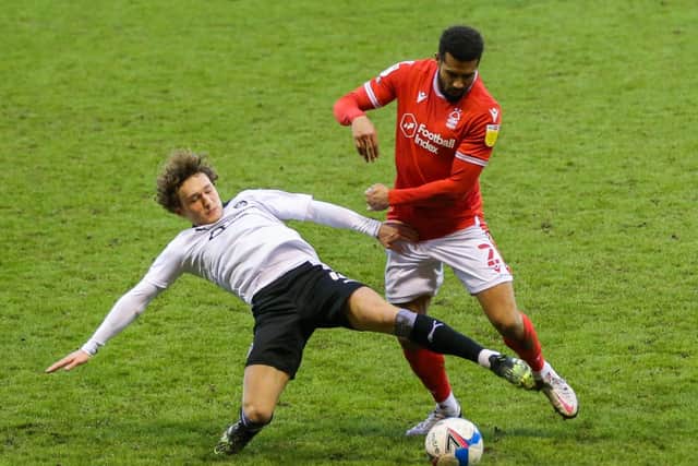 Nottingham Forest's Cyrus Christie (right) and Barnsley's Callum Styles (Picture: Isaac Parkin/PA)