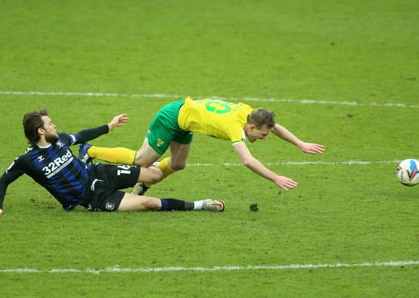 Norwich City's Oliver Skipp goes down after a challenge from Middlesbrough's Jonny Howson (left) (Picture: PA)