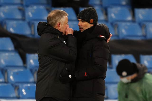 Pep Guardiola manager of Manchester City talks to Chris Wilder manager of Sheffield United at the final whistle (Picture: Darren Staples/Sportimage)
