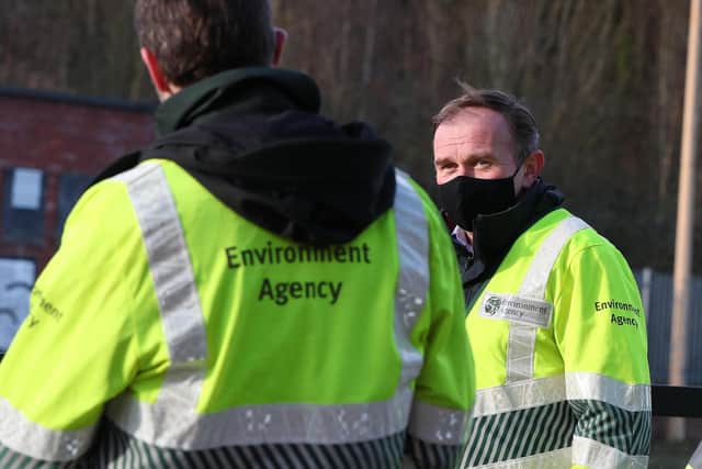 George Eustice, Secretary of State for Environment, Food and Rural Affairs (right) speaking to Environment Agency staff in Northwich, Cheshire, in the aftermath of Storm Christoph. Photo: PA