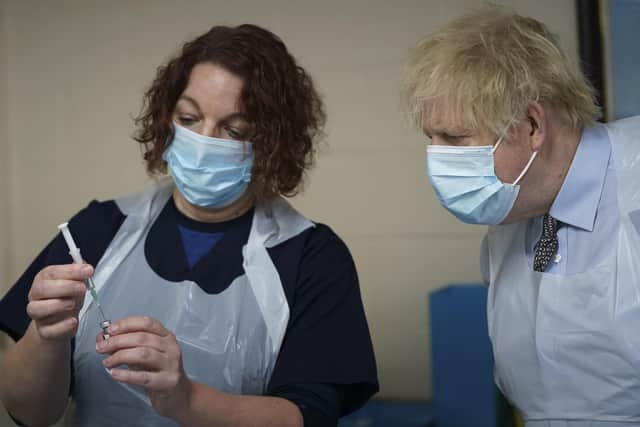 Boris Johnson during a visit to a vaccine centre.