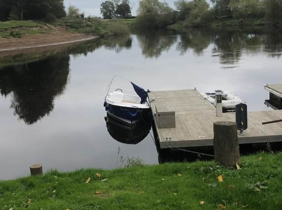 The ferry is moored near the point where the Ouse and the Nidd meet