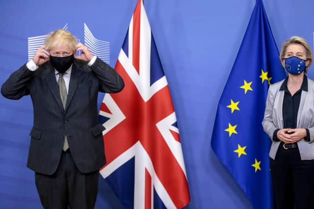 Britain's Prime Minister Boris Johnson (L) is welcomed by European Commission President Ursula von der Leyen in December during Brexit talks.