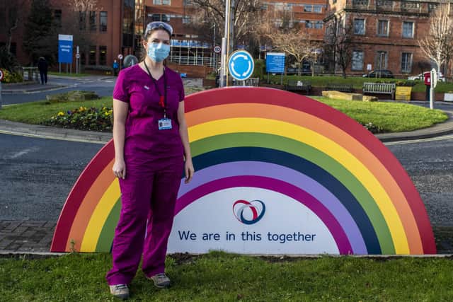 Senior Covid 19 researcher Dr Jenny Murira photographed by the big rainbow near the main entrance of St James's Teaching Hospital in Leeds. Picture: Ernesto Rogata.