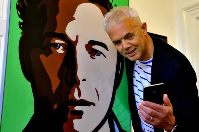 Andrew Stewart taking a selfie with Julian, a self-portrait of artist Julian Opie, at his gallery, 108 Fine Art. (Gary Longbottom).