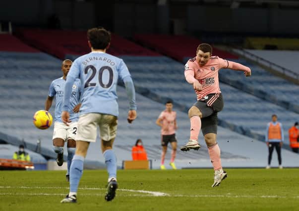 John Fleck of Sheffield United fires a shot wide during the Premier League match at the Etihad Stadium, Manchester. (Picture: Darren Staples/Sportimage)
