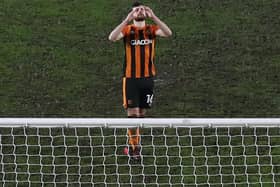 Hull City substitute Jordan Flores cannot hide his dismay after missing the decisive spot-kick in his side's Papa John's Trophy defeat to Lincoln City. Pictures: Getty Images