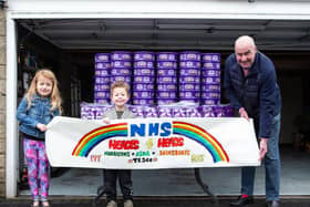 John Croft, with neighbours Ivy Greenwell, aged six, and four-year-old brother Ray, who will hand out Heroes to NHS staff in West Yorkshire