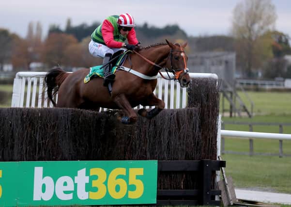 This was Definitly Red winning the 2018 Charlie Hall Chase under Danny Cook.