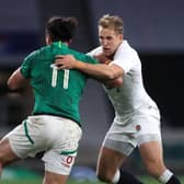 RISING STAR: England's Max Malins (right) tackles Ireland's James Lowe. Picture: Adam Davy/PA Wire.
