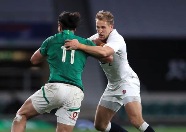 RISING STAR: England's Max Malins (right) tackles Ireland's James Lowe. Picture: Adam Davy/PA Wire.