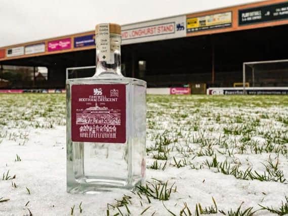 Bottle of Farewell Bootham Crescent special edition gin on the pitch Photo: Mark Comer