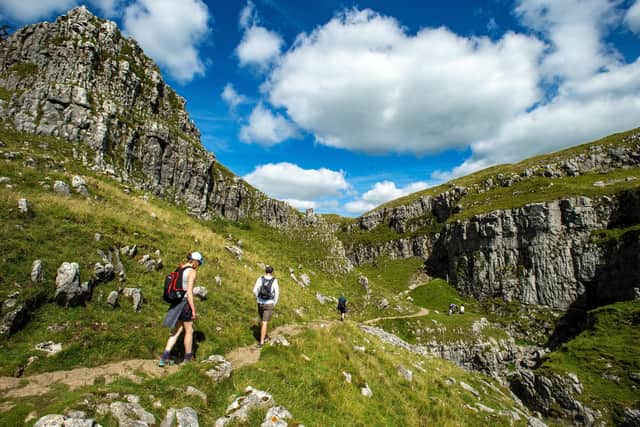 Malham cove is very popular with walkers and tourists, but how can its environment be protected? Photo: Bruce Rollinson.