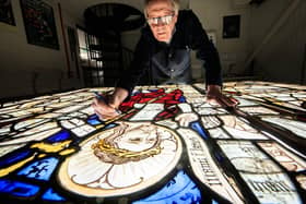 Conservator Keith Barley MBE works on large stained glass windows from All Saints North Street Church at Barley Studio in York. Barley Studio will conserve twelve medieval windows over the next two years. Image: Danny Lawson/PA Wire
