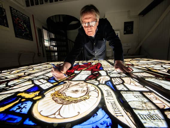 Conservator Keith Barley MBE works on large stained glass windows from All Saints North Street Church at Barley Studio in York. Barley Studio will conserve twelve medieval windows over the next two years. Image: Danny Lawson/PA Wire