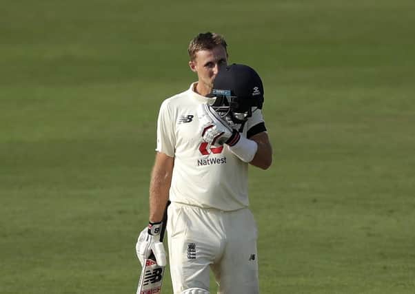 REMARKABLE: England captain Joe Root kisses his protective helmet after reaching a century on day one of the first Test match against Inida in Chennai. Picture courtesy of BCCI (via ECB)