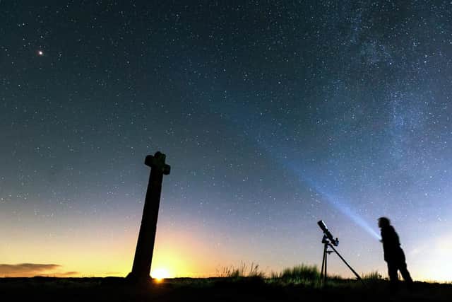 Dark Skies campaigner Richard Darn surveys the night sky on the North Yorkshire Moors. (Bruce Rollinson).