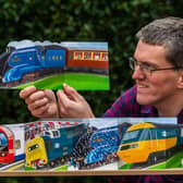 The train and bus enthusiast has seen sales of his hand-cut transport-themed cards rocket Picture: James Hardisty