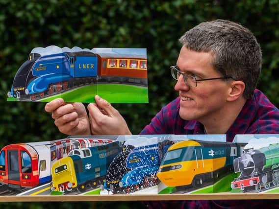 The train and bus enthusiast has seen sales of his hand-cut transport-themed cards rocket Picture: James Hardisty