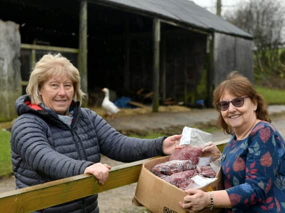 Gill Ward receives a delivery of meat from her neighbour's farm