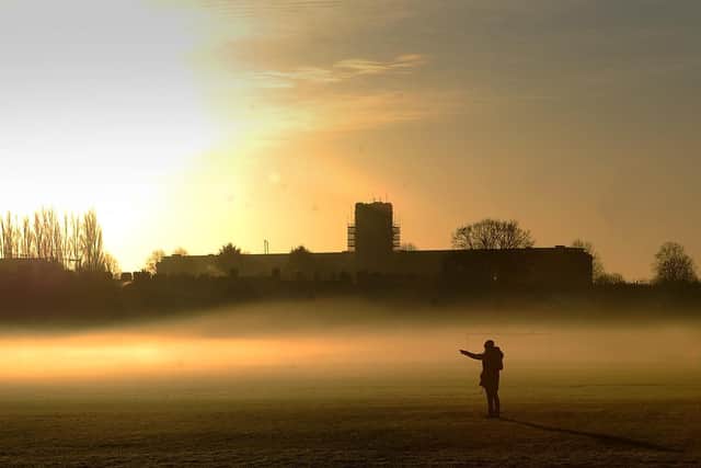 Low lying mist on the Knavesmire, York, with the former Terry's Chocolate Factory in the background on December 25, 2019. Picture by Simon Hulme.