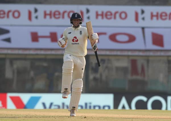 TV star: Joe Root celebrates his century, which was seen by armchair viewers. Picture: Pankaj Nangia/Sportzpics for BCCI.