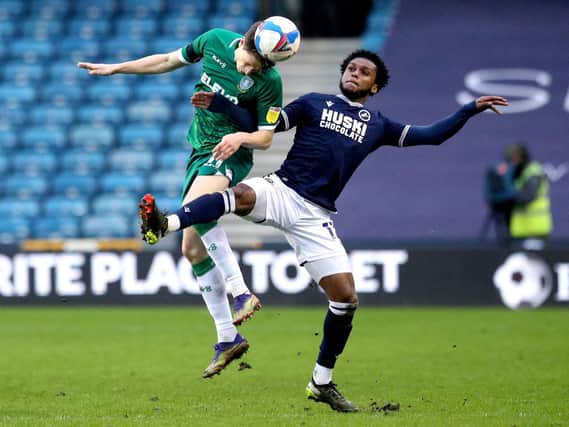 TUSSLE: Sheffield Wednesday's Adam Reach (left) and Millwall's Mahlon Romeo battle for the ball. Picture: PA Wire.
