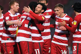 Doncaster Rovers players celebrate Jon Taylor's opening goal against Oxford United. Pictures: Jonathan Gawthorpe