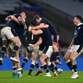 Scotland's Stuart Hogg, Cameron Redpath and Huw Jones celebrate following their side's victory after the Guinness Six Nations match against England at Twickenham Stadium (Photo by Mike Hewitt/Getty Images)