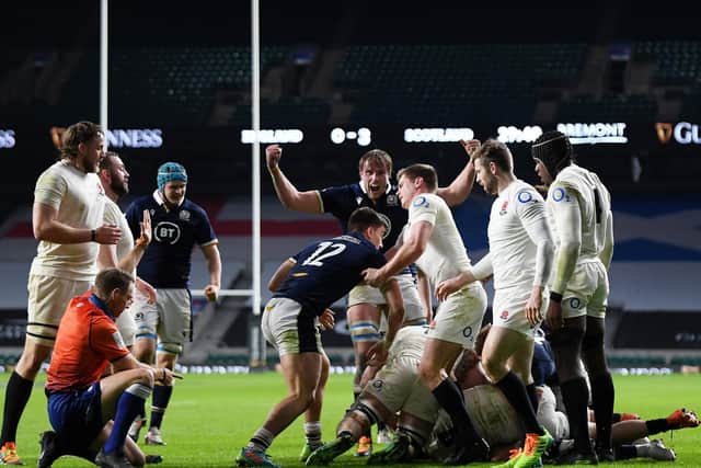 Andrew Brace awards Scotland their try scored by Duhan van der Merwe against England. (Photo by Mike Hewitt/Getty Images)