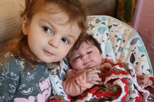 The bouncing bundle of joy has been able to return home where she lives with her big sister, three-year-old Holly