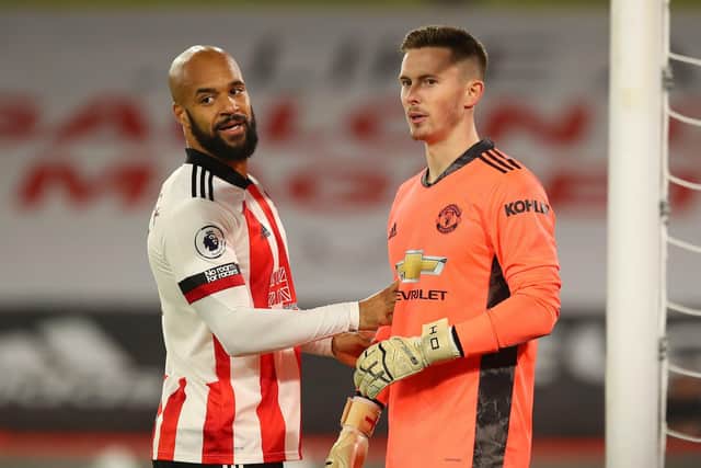 Dean Henderson, right, pictured with Sheffield United's David McGoldrick on his return to Bramall Lane with Manchester United earlier this season. Picture: Simon Bellis/Sportimage