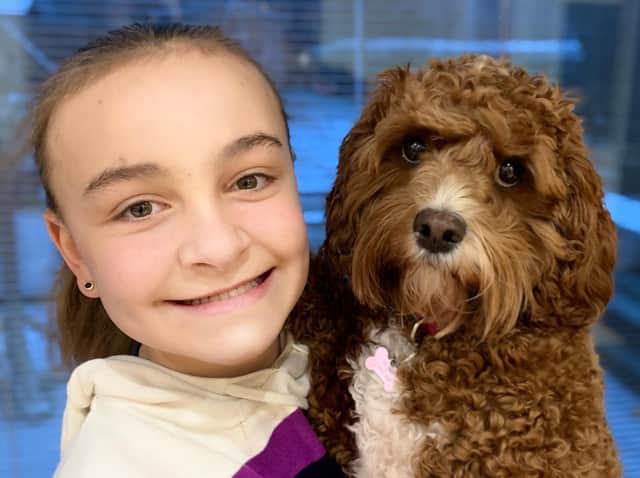 Pictured, Ashville College Year 7 pupil Emilia Peer-Alton who took her dog Lottie to an online assembly, after more than 80 pupils were encouraged to bring their pet along. Photo credit: Ashville College