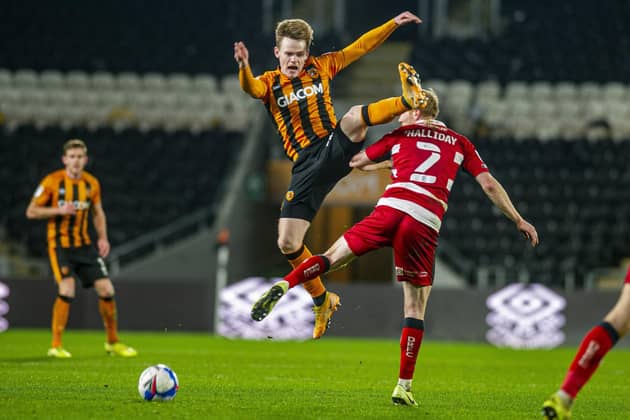League One action: Hull City's Keane Lewis-Potter challenges Doncaster Rovers' Brad Halliday.  Picture: Tony Johnson