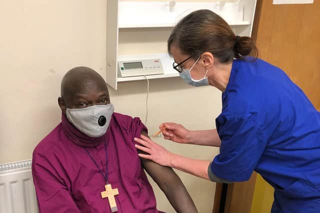 The  former Archbishop of York Dr John Sentamu, pictured yesterday being vaccinated by Nurse Christine. Photo credit: Submitted picture