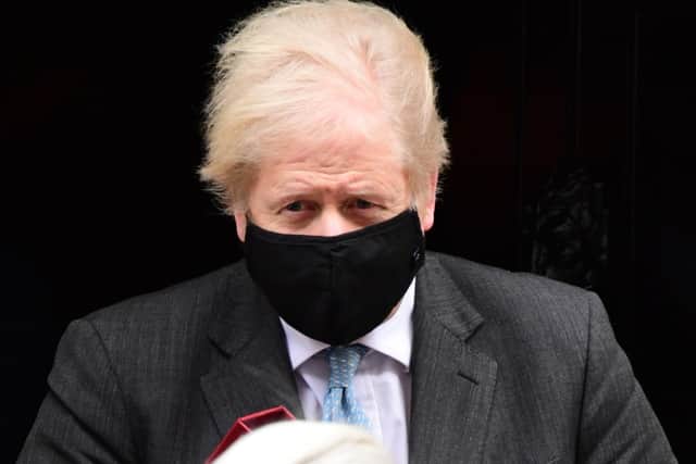 Boris Johnson leaves 10 Downing Street for Prime Minister's Questions.