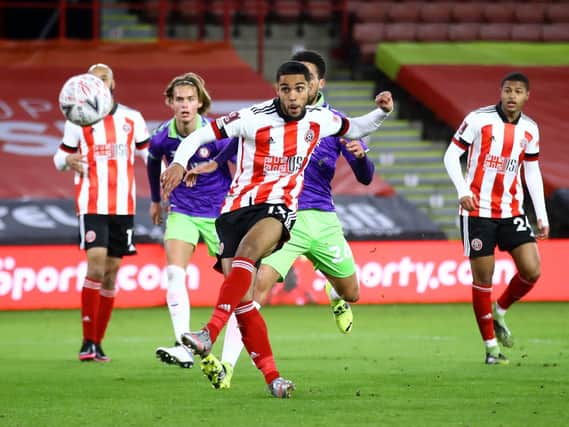 CHANCE: Max Lowe hits the crossbar for Sheffield United