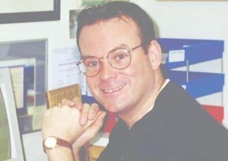 John Kikrby in his home office in 1996.